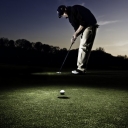 round image of a man playing golf